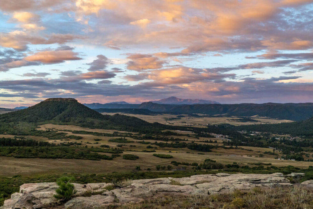 Sunrise view of JA Ranch bluff and pikes peak landscape in background